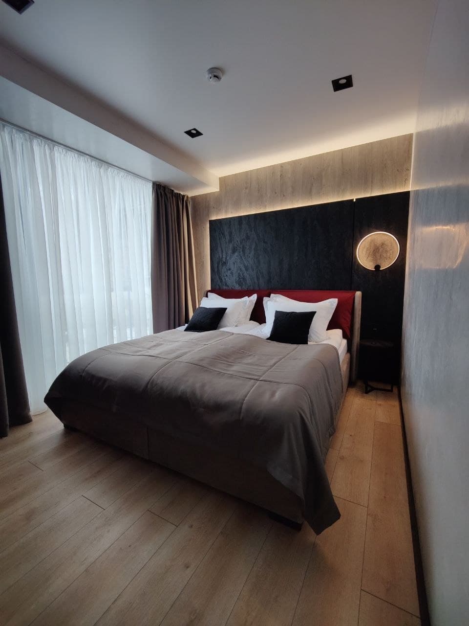 Bedroom perspective with a textured wall finish and a soft ceiling wash
