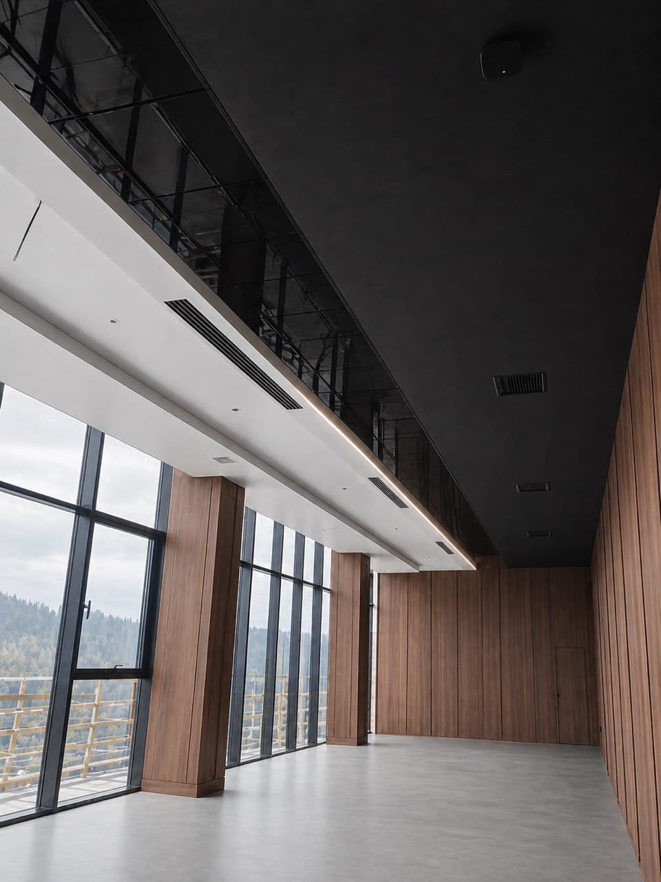 Double-height window zone with wood wall cladding and a shadow ceiling