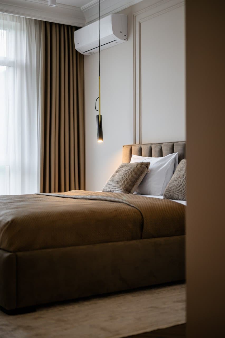 Bedroom entrance view with a paneled wall composition and soft neutral tones