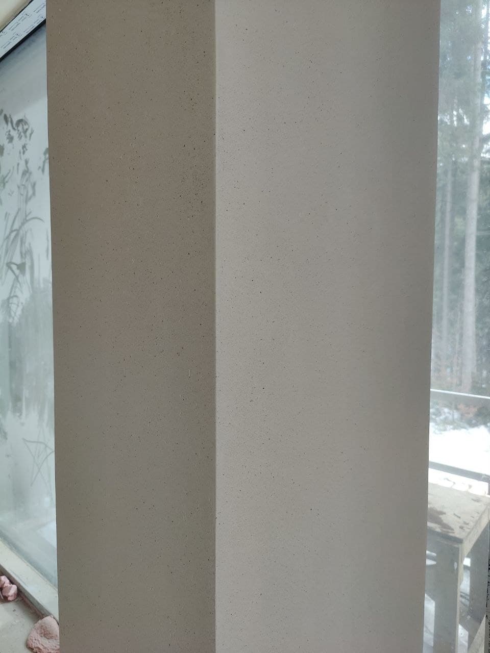 Decorative wall finish close-up with a subtle mineral texture