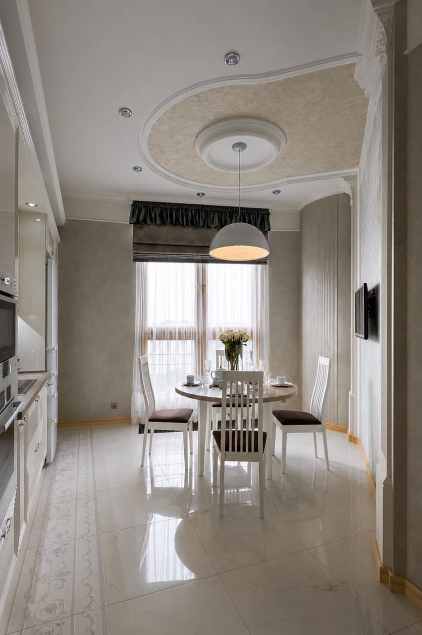 Bright dining hall with classical ceiling moldings and a decorative wall finish