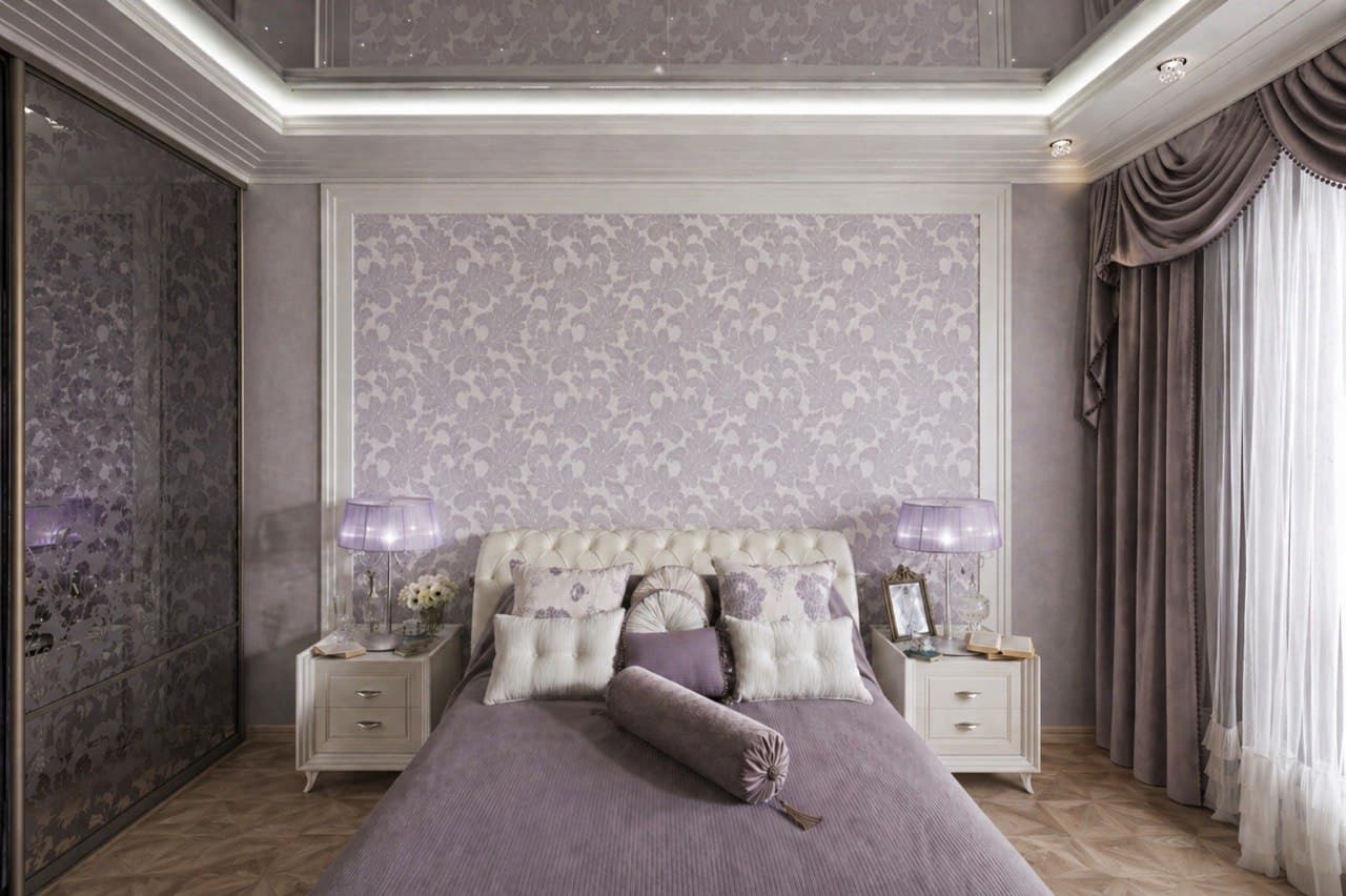 Classic bedroom with a floral decorative wall finish, layered curtains, and soft lighting