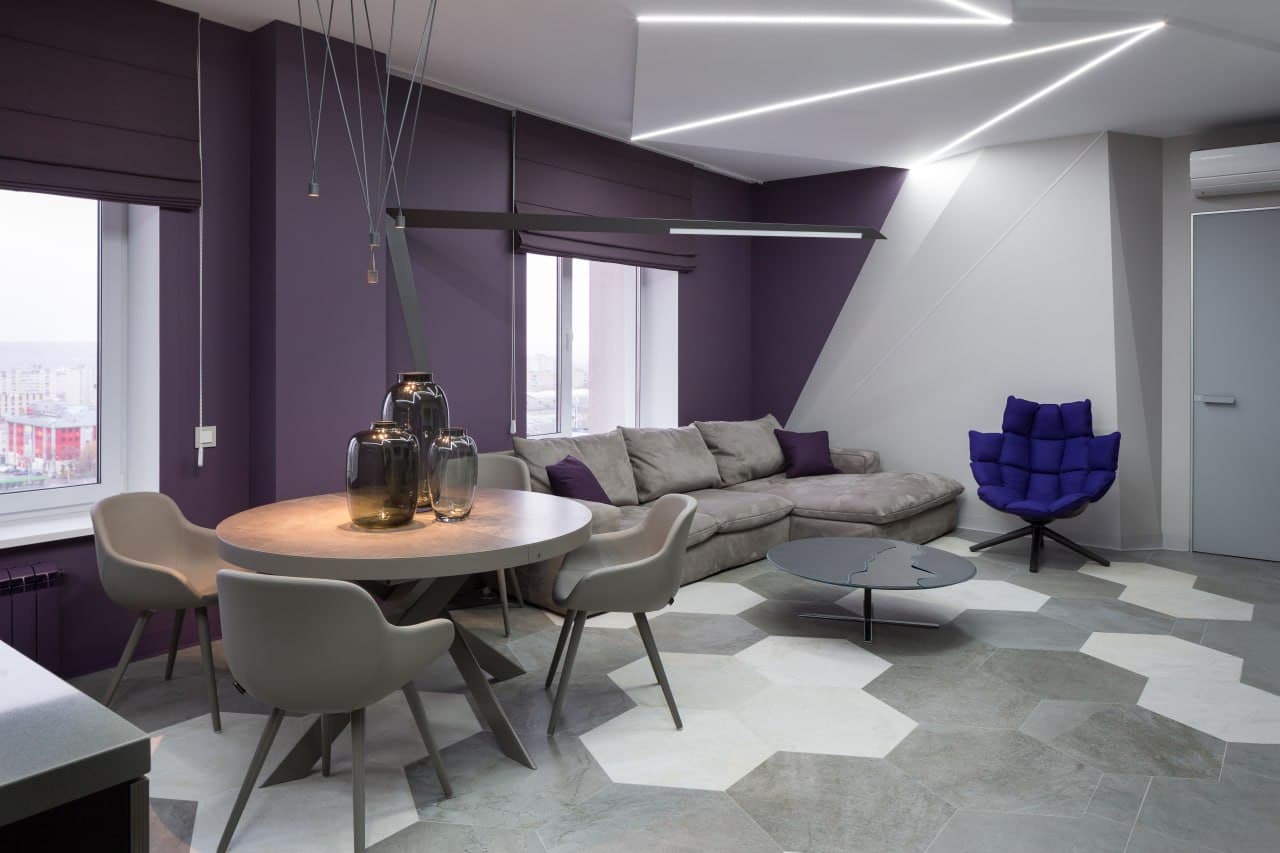 Dining area with geometric ceiling lighting and layered decorative paint