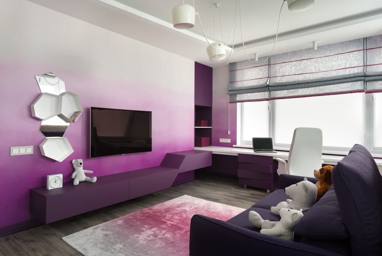 Media room with gradient decorative paint, geometric wall art, and purple built-ins