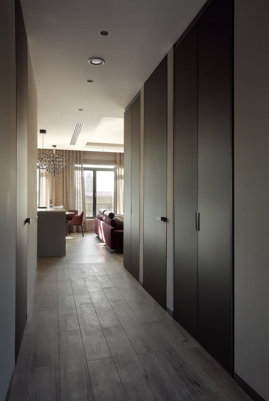 Corridor with concealed doors, clean junctions, and architectural precision