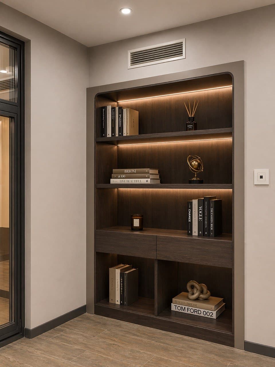 Illuminated shelving niche with dark wood joinery and integrated lighting