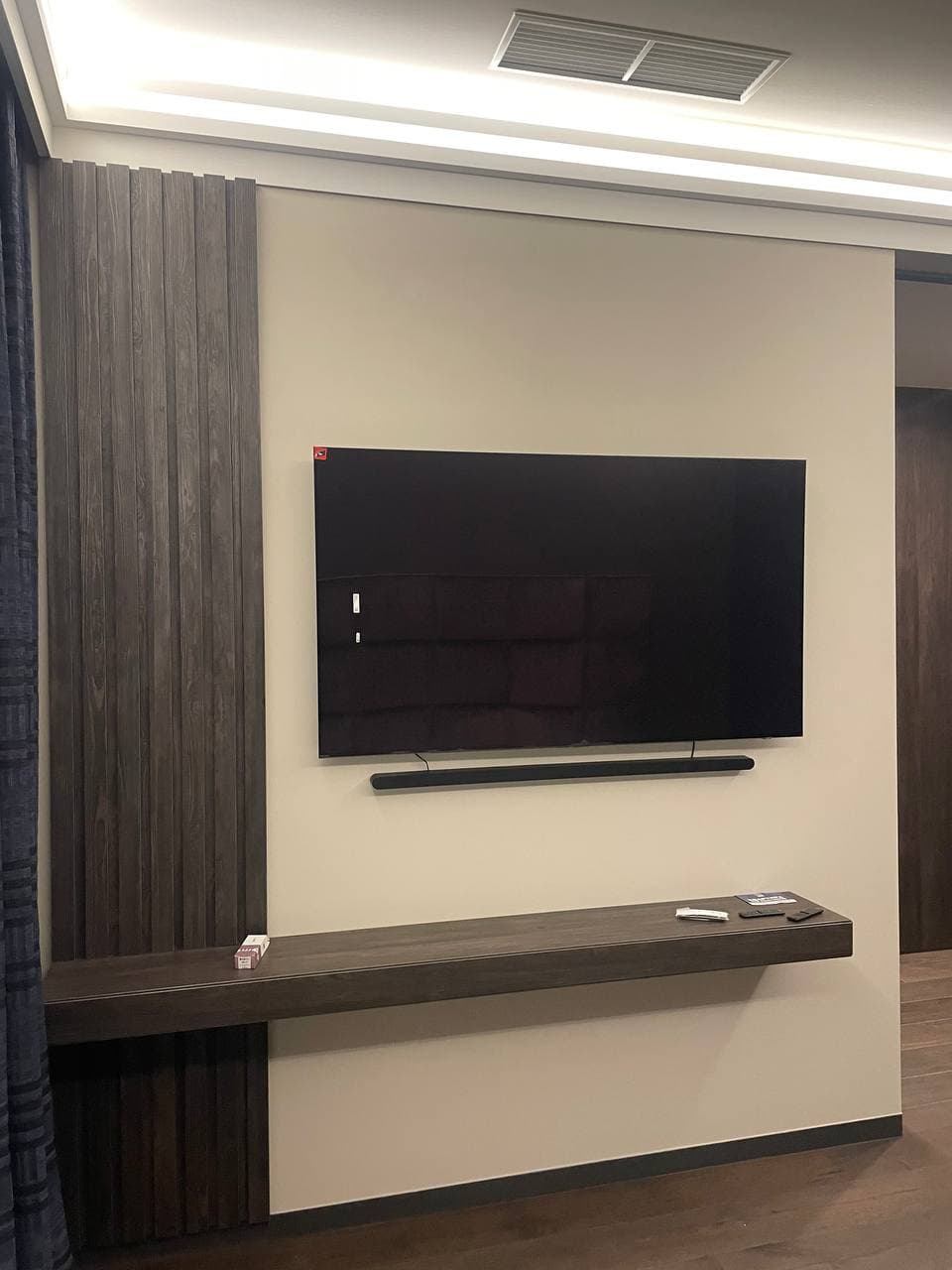 Media wall with matte decorative paint and a floating console